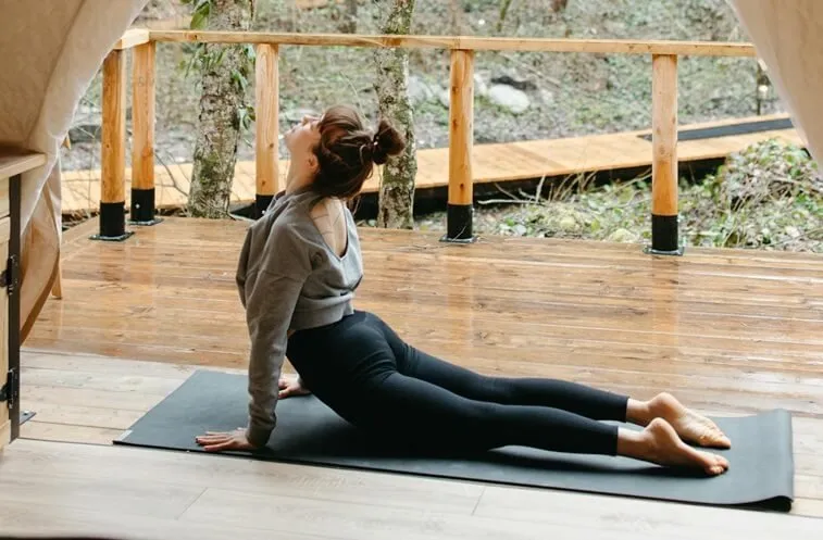 Person in a low cobra backbend