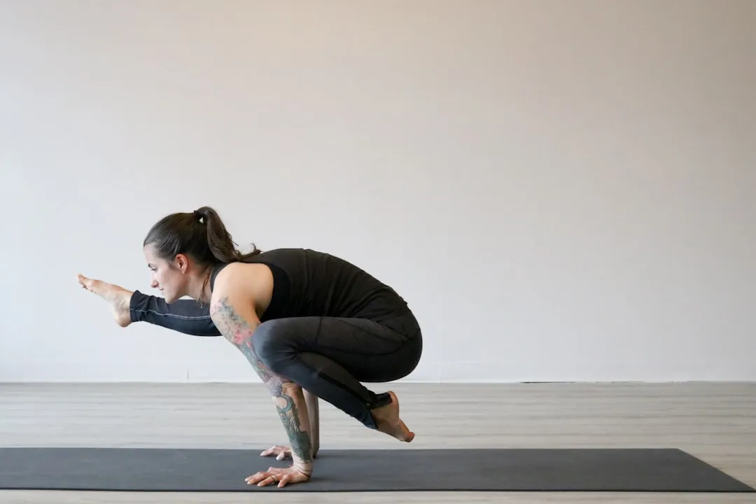 Person seated in a spinal twist with one hand resting behind the back