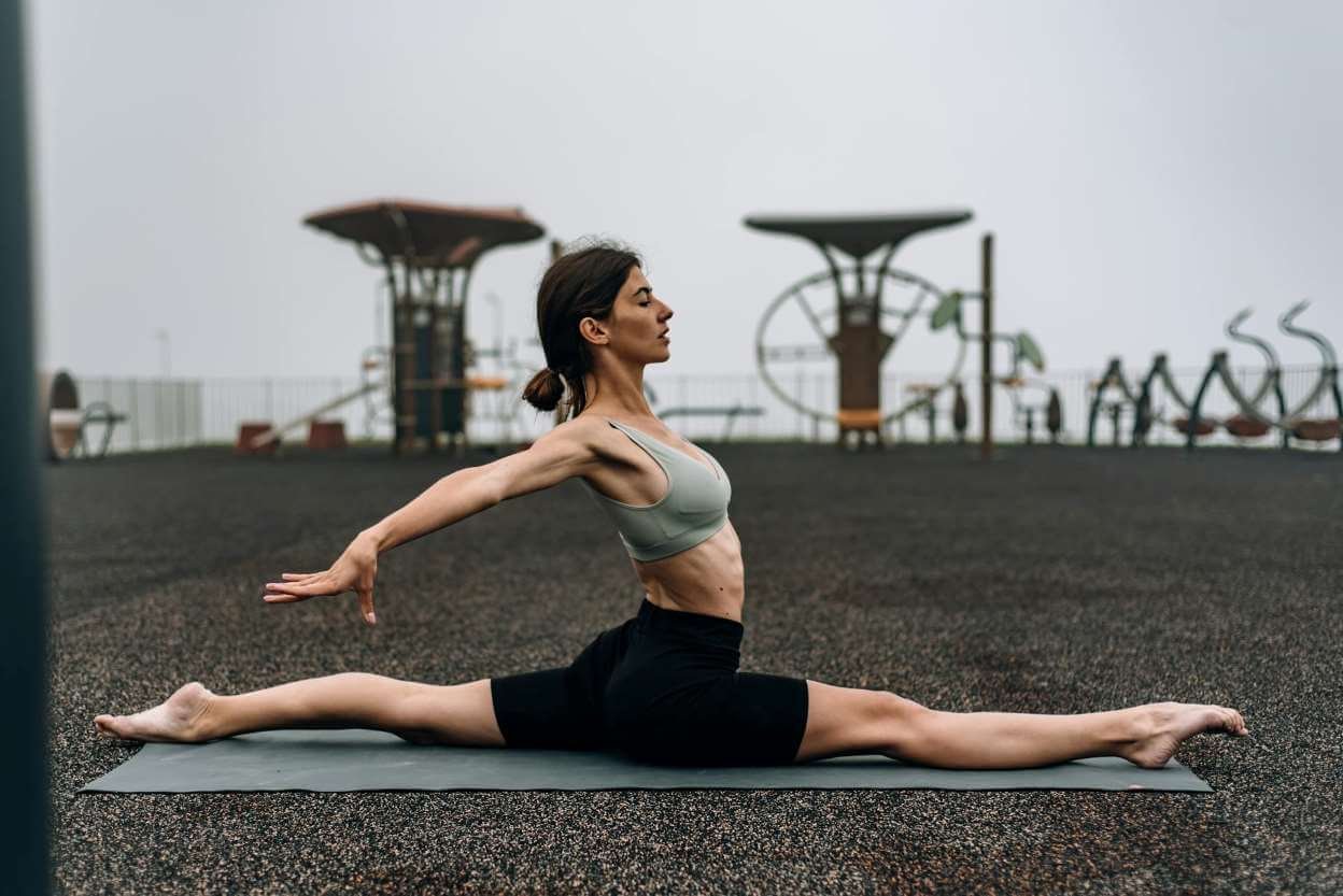 girl doing yoga for flexible legs